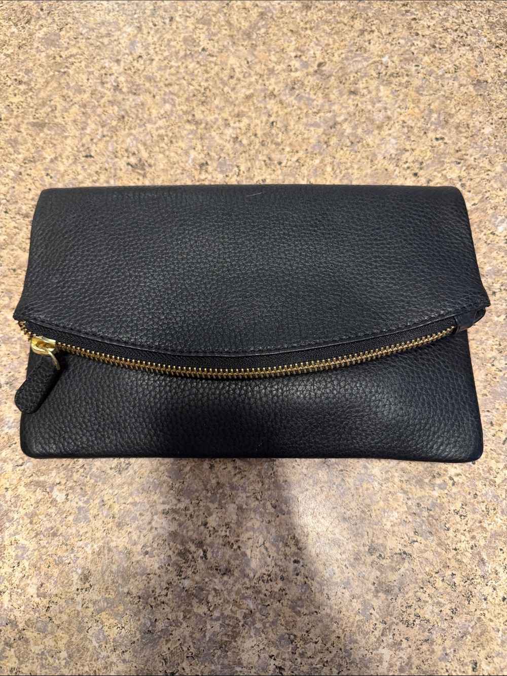 Classic Black Leather Fold-Over Clutch with Gold Zip Accent